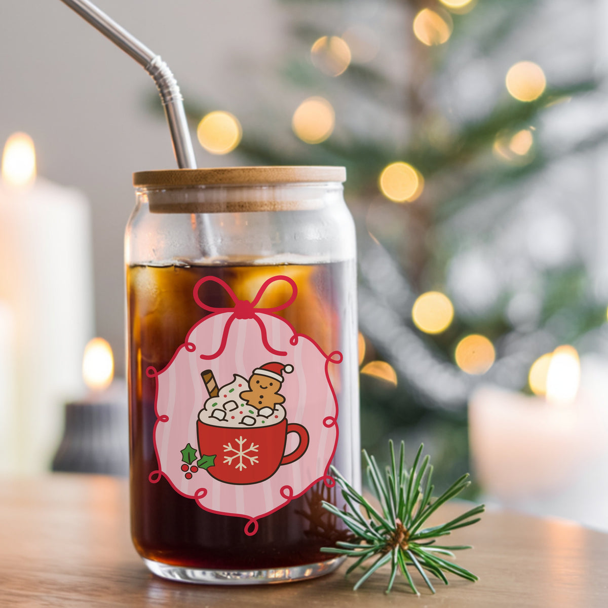 Coquette Gingerbread Hot Cocoa UV DTF sticker applied to a glass can cup of iced coffee with a straw