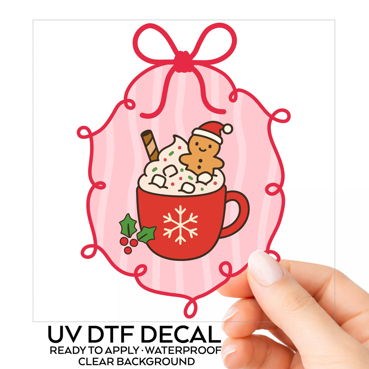Coquette Gingerbread Hot Cocoa UV DTF sticker on its backing card, held in hand