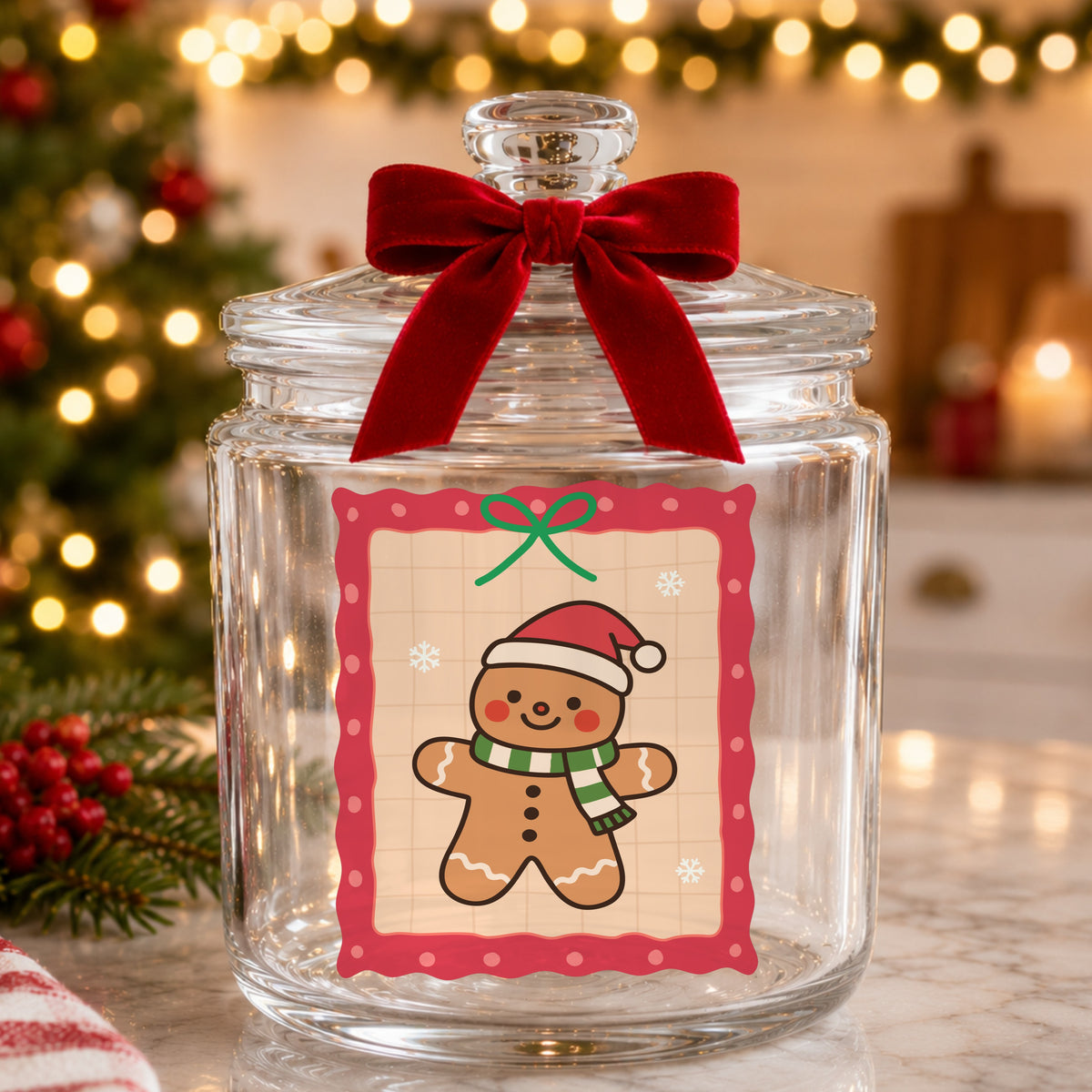 Coquette Gingerbread Man UV DTF sticker applied to a glass candy jar tied with a red bow