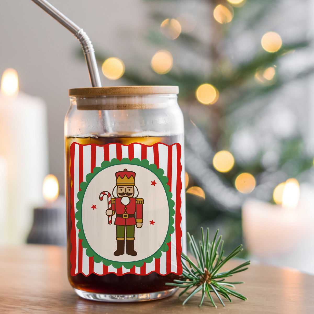 Coquette Nutcracker Soldier UV DTF sticker applied to a glass can cup of iced coffee with a straw