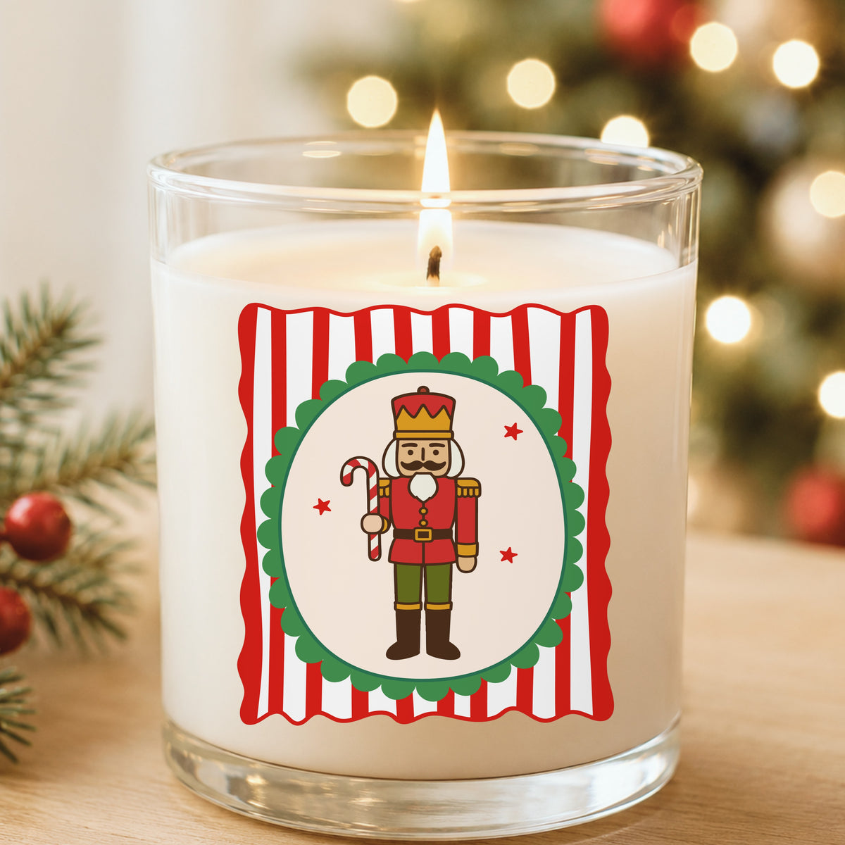 Coquette Nutcracker Soldier UV DTF sticker applied to a white candle in a glass holder near Christmas lights
