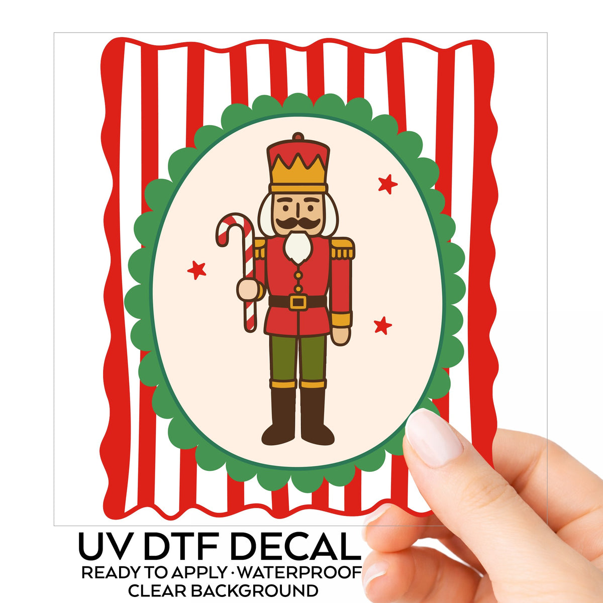 Coquette Nutcracker Soldier UV DTF sticker on its backing card, held in hand