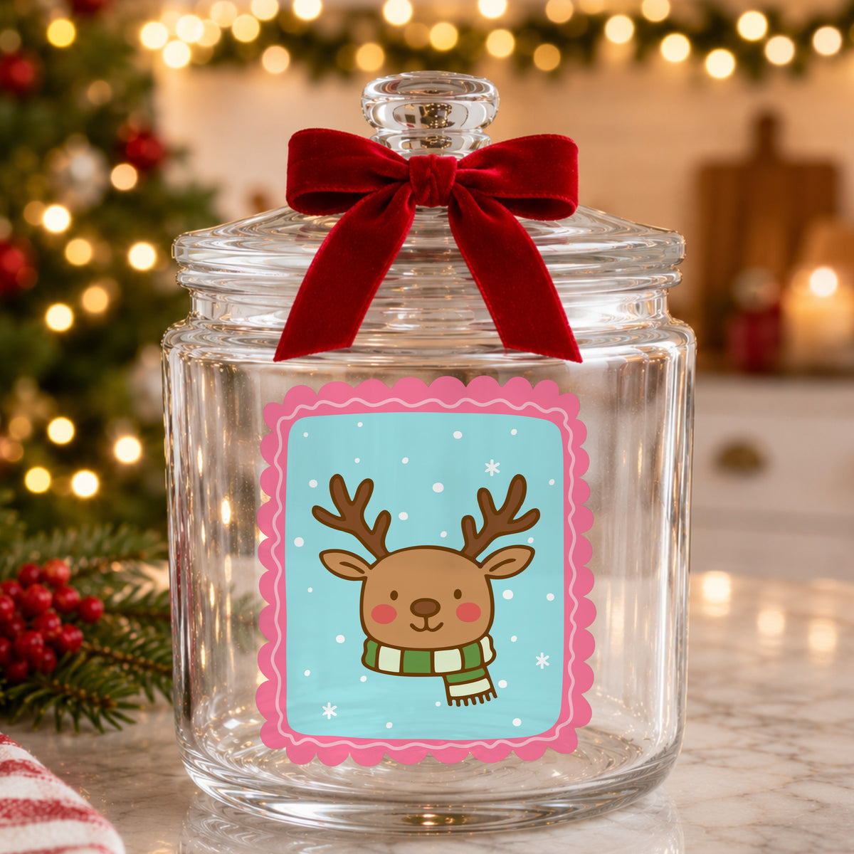 Coquette Reindeer Face UV DTF sticker applied to a glass candy jar tied with a red bow