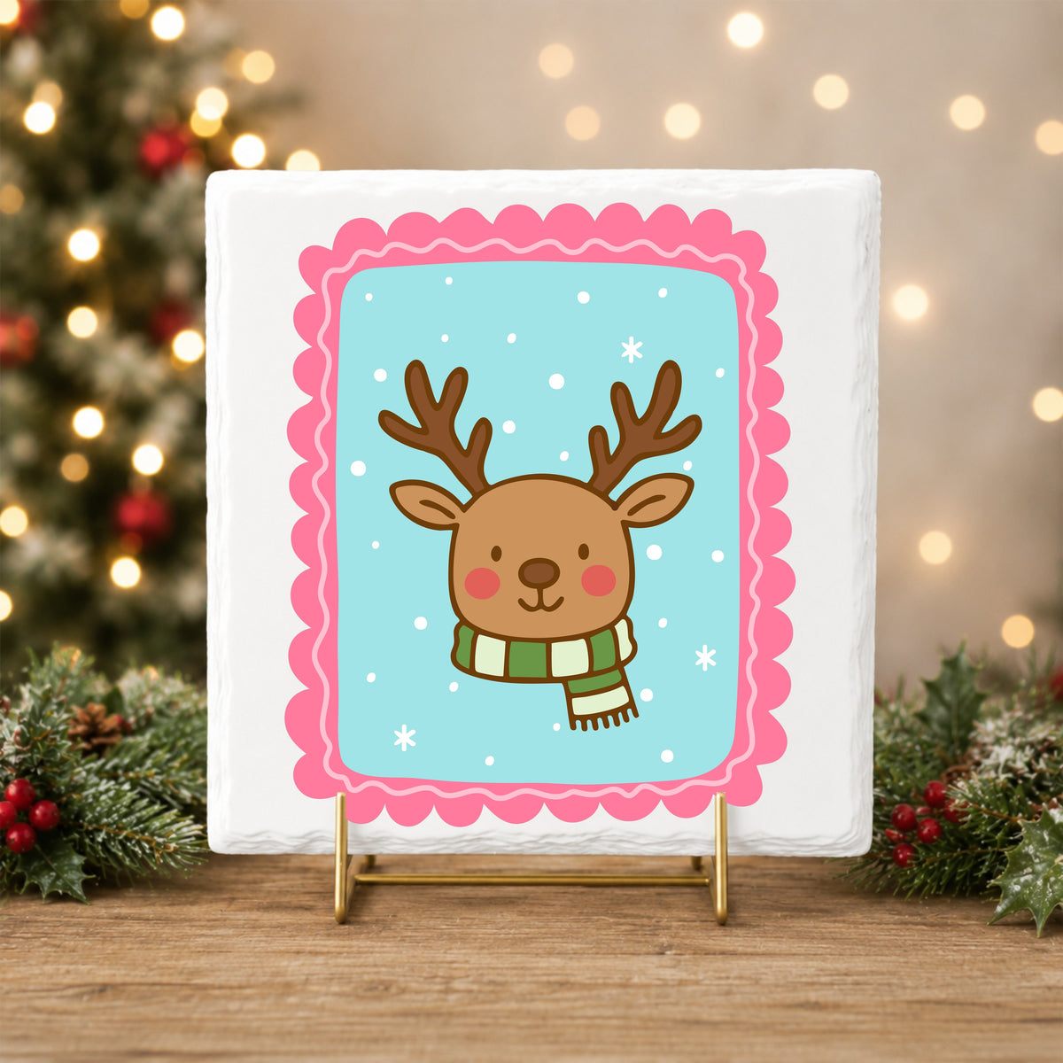 Coquette Reindeer Face UV DTF sticker applied to a white tile on a gold stand