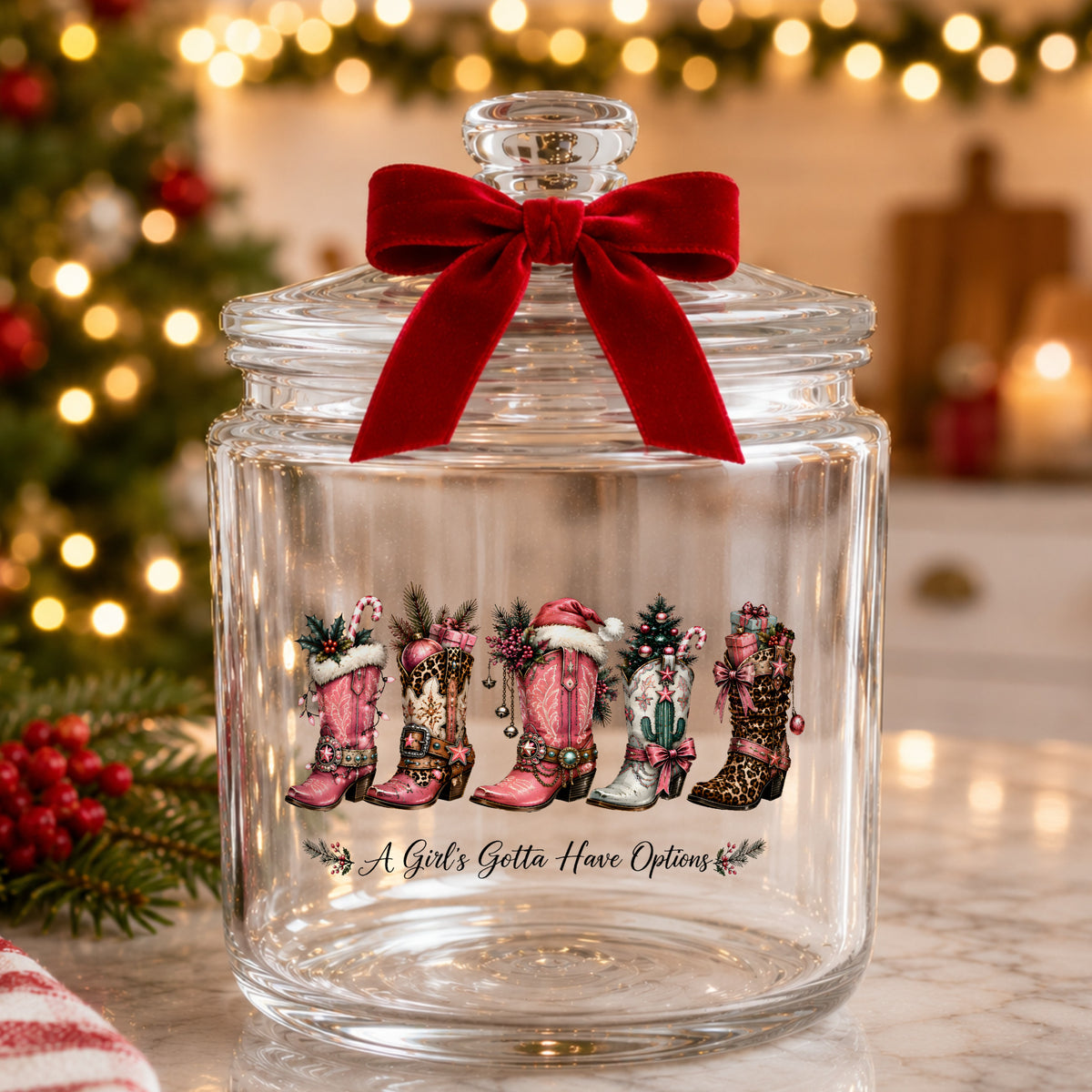 A Girls Gotta Have Options Christmas Boots UV DTF sticker applied to a glass candy jar tied with a red bow