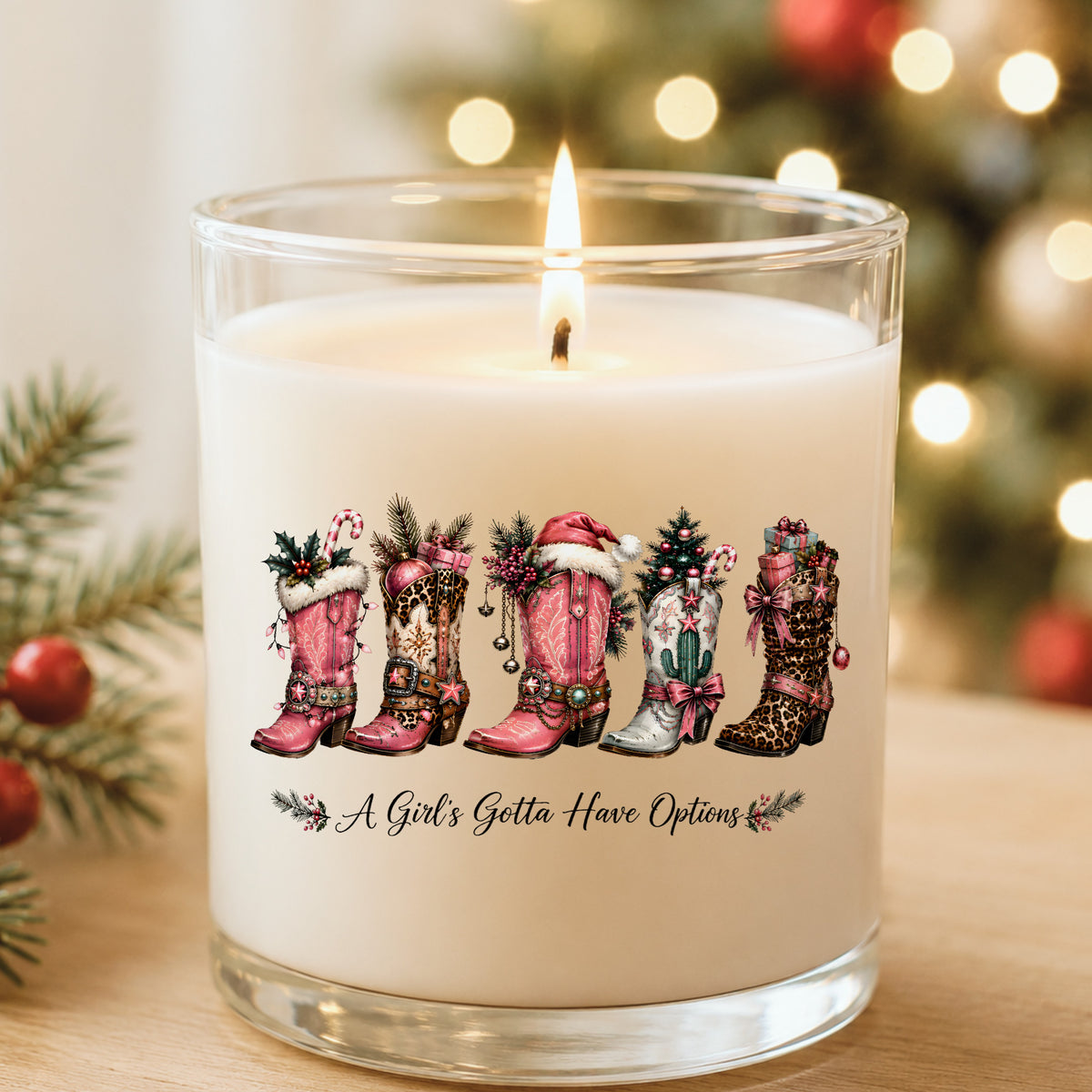 A Girls Gotta Have Options Christmas Boots UV DTF sticker applied to a white candle in a glass holder near Christmas lights