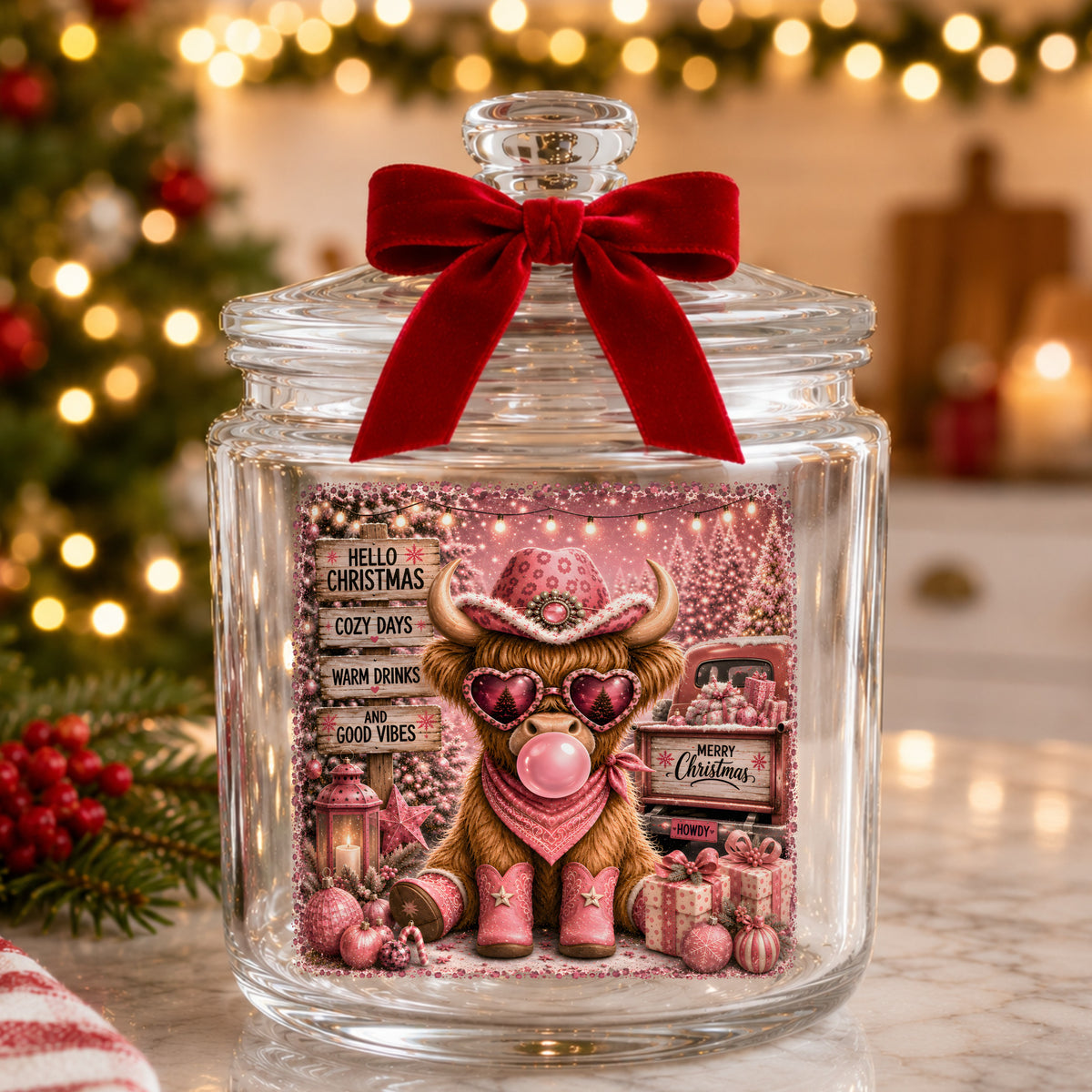 Pink Highland Cow Hello Christmas UV DTF sticker applied to a glass candy jar tied with a red bow