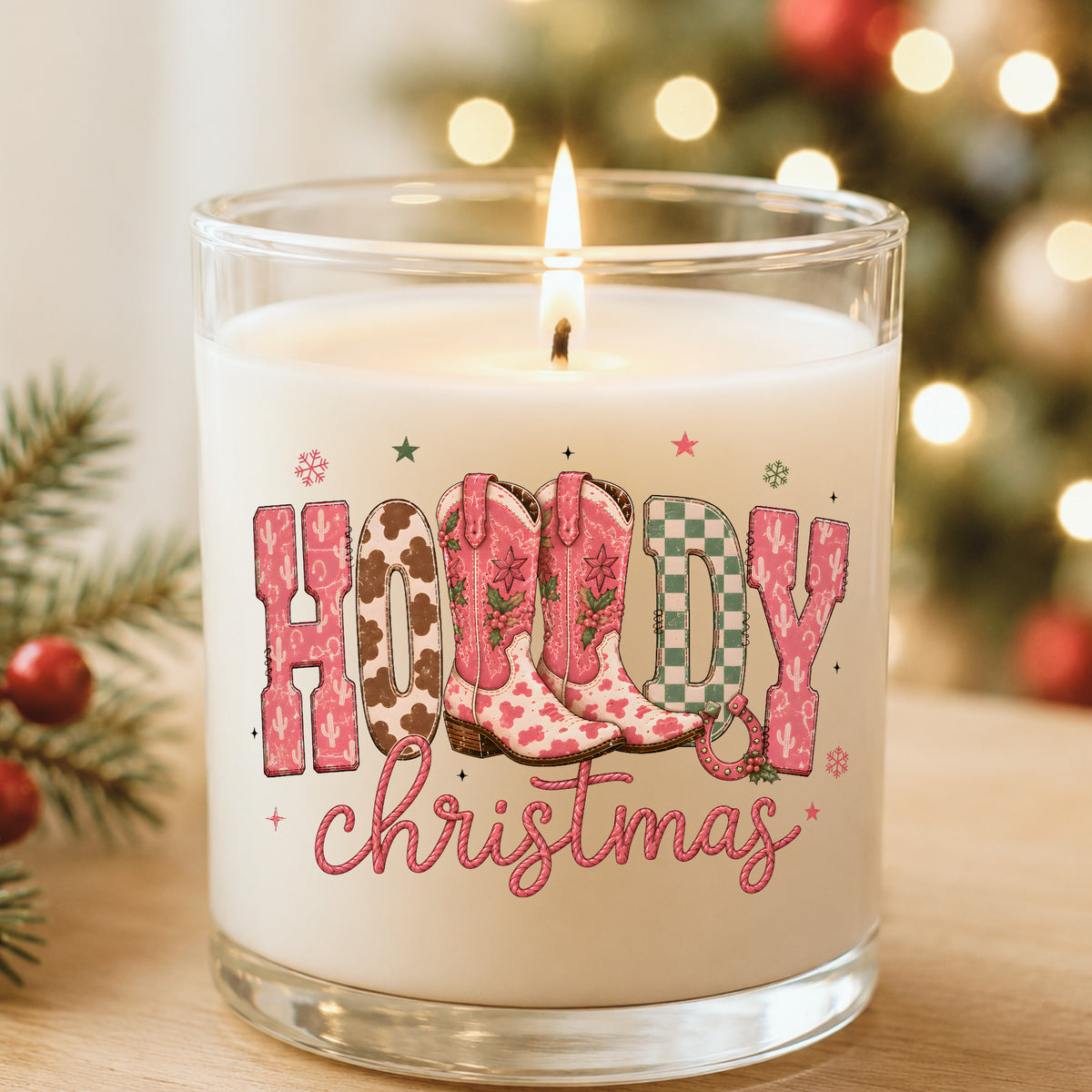 Howdy Christmas Cowboy Boots UV DTF sticker applied to a white candle in a glass holder near Christmas lights