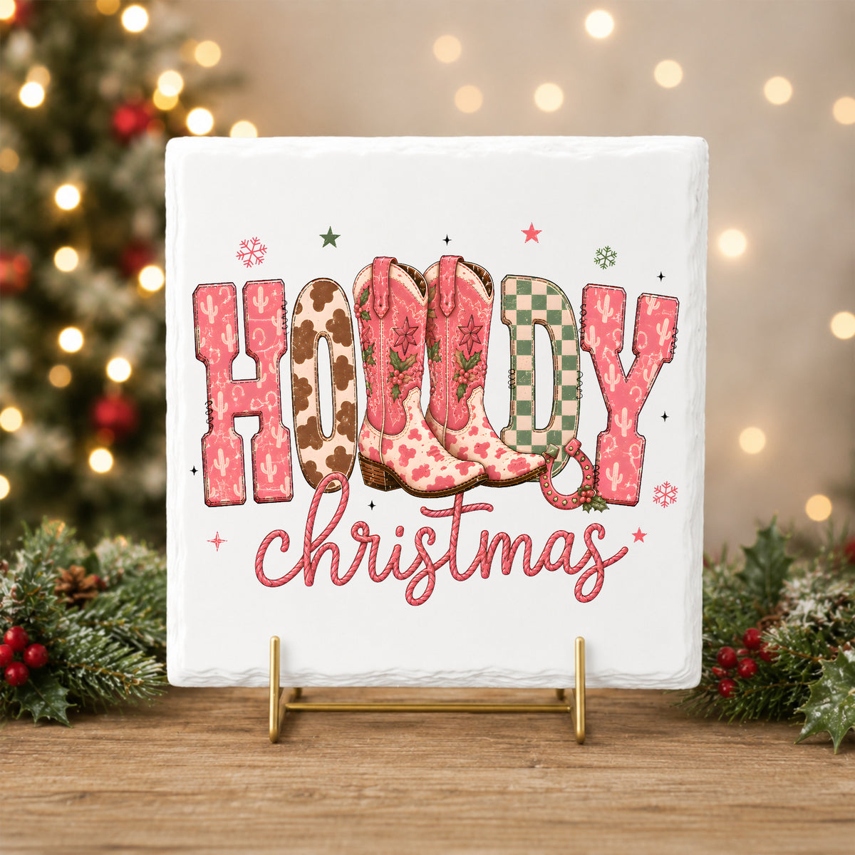 Howdy Christmas Cowboy Boots UV DTF sticker applied to a white tile on a gold stand