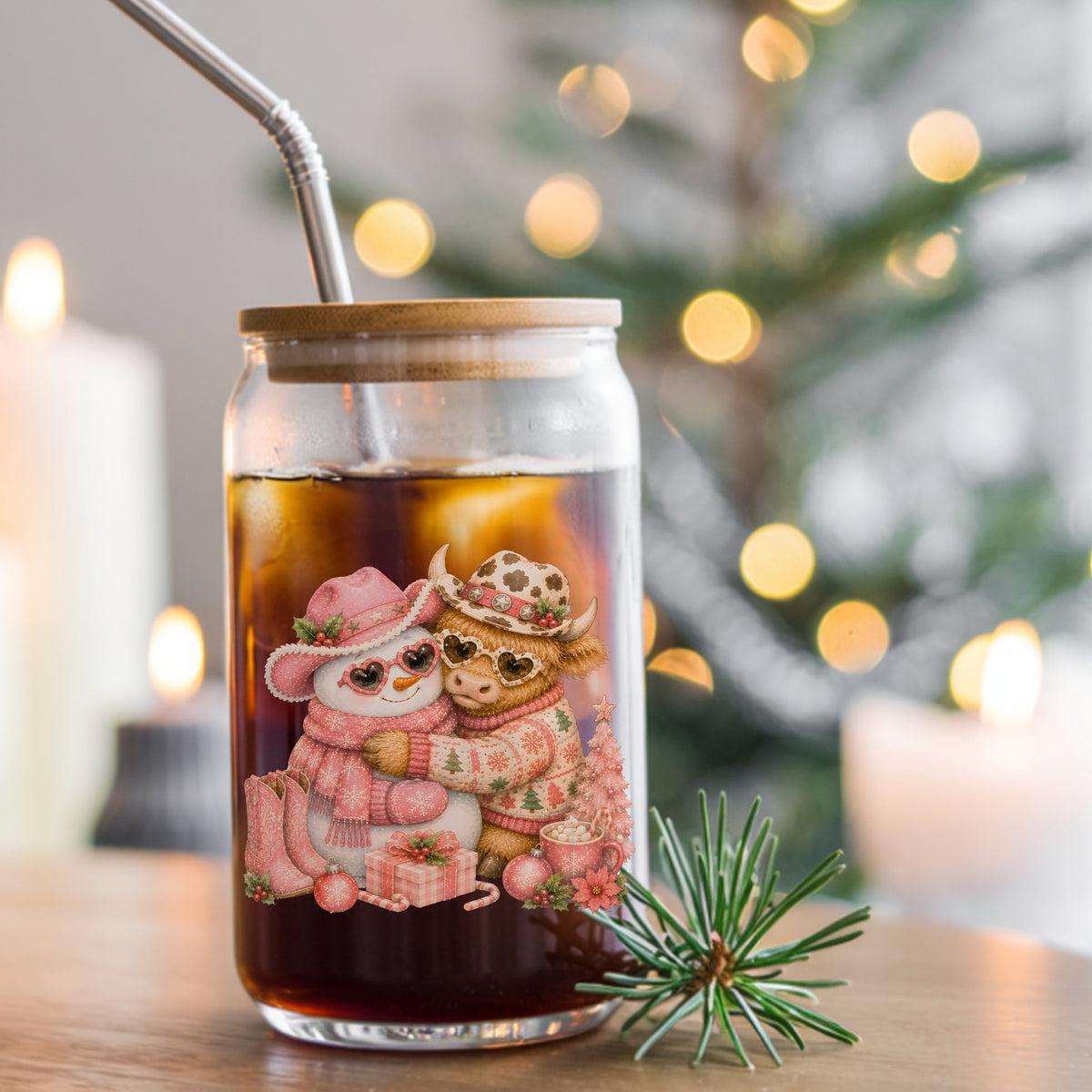 Snowman Highland Cow Christmas Hug UV DTF sticker applied to a glass can cup of iced coffee with a straw