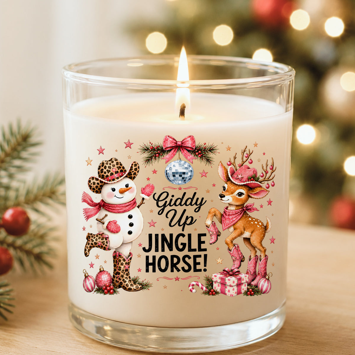 Giddy Up Jingle Horse Snowman Reindeer UV DTF sticker applied to a white candle in a glass holder near Christmas lights