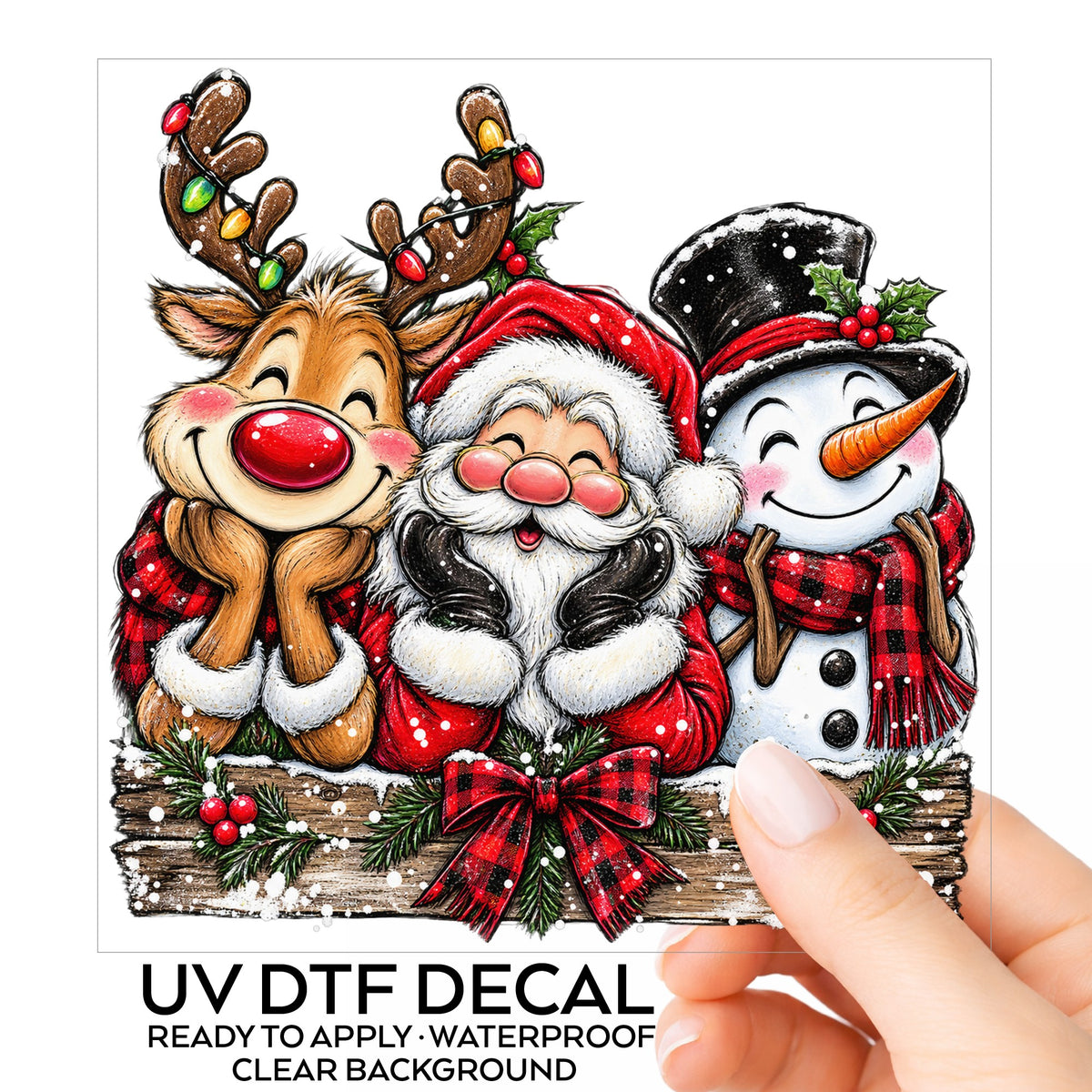 Santa Reindeer Snowman Plaid Bow UV DTF sticker on its backing card, held in hand