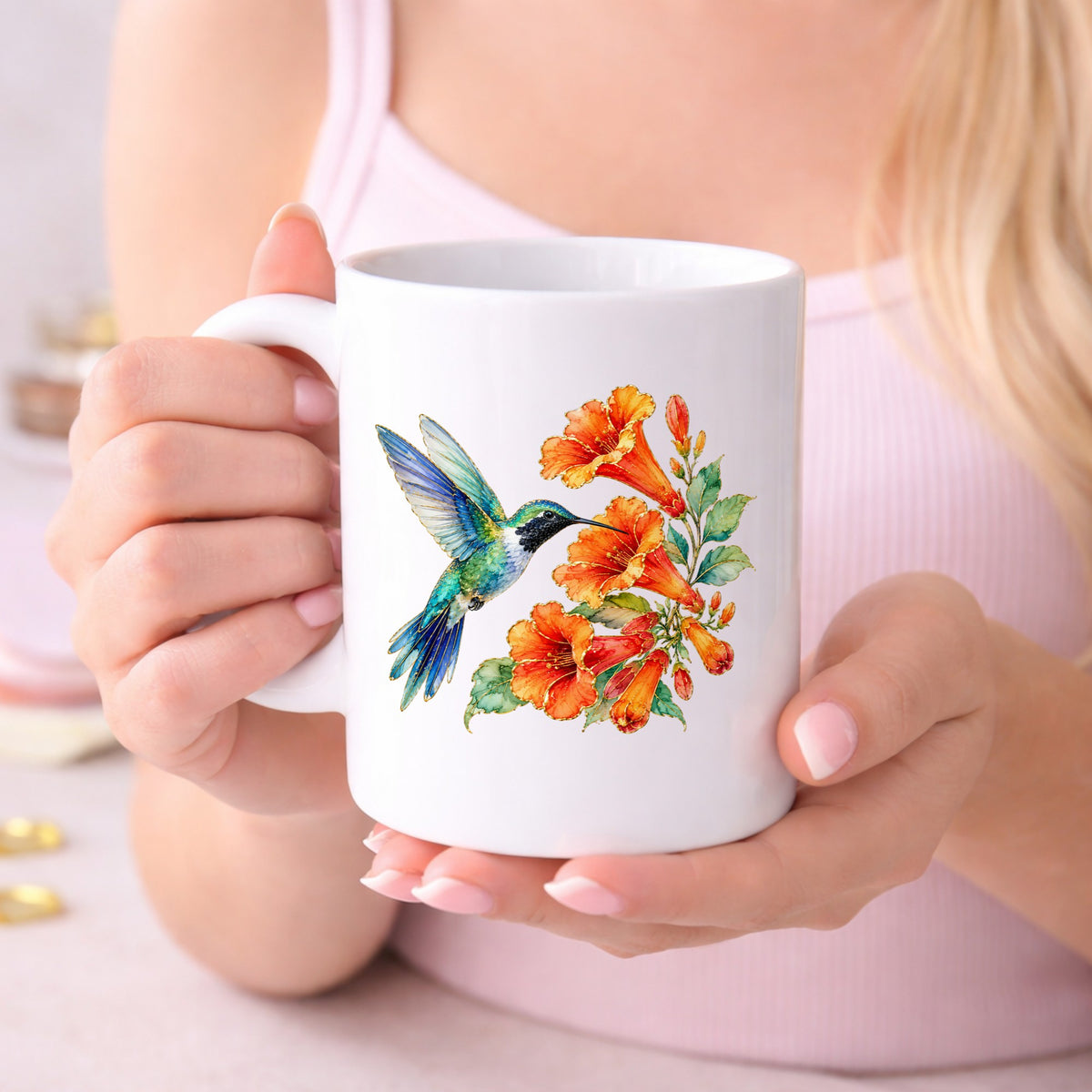 Blue Hummingbird Trumpet Flowers UV DTF sticker applied to a white coffee mug held in both hands