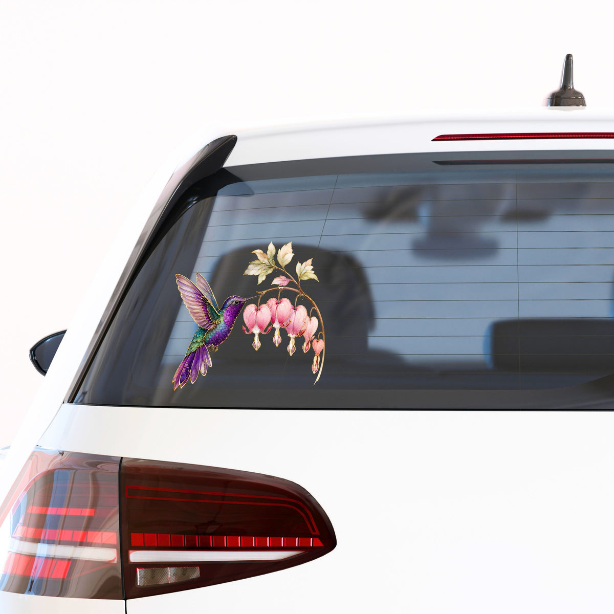 Purple Hummingbird Bleeding Heart UV DTF sticker applied to the rear window of a white car