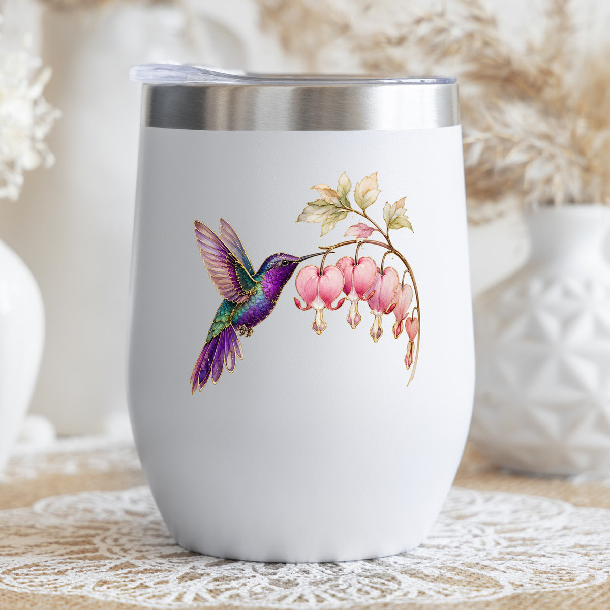Purple Hummingbird Bleeding Heart UV DTF sticker applied to a white stemless tumbler with a lid