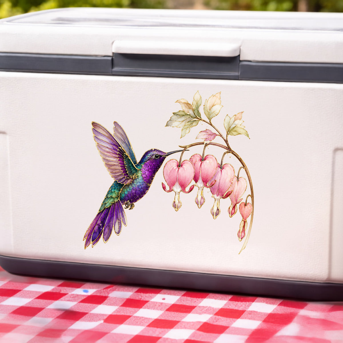 Purple Hummingbird Bleeding Heart UV DTF sticker applied to a white cooler on a red gingham cloth