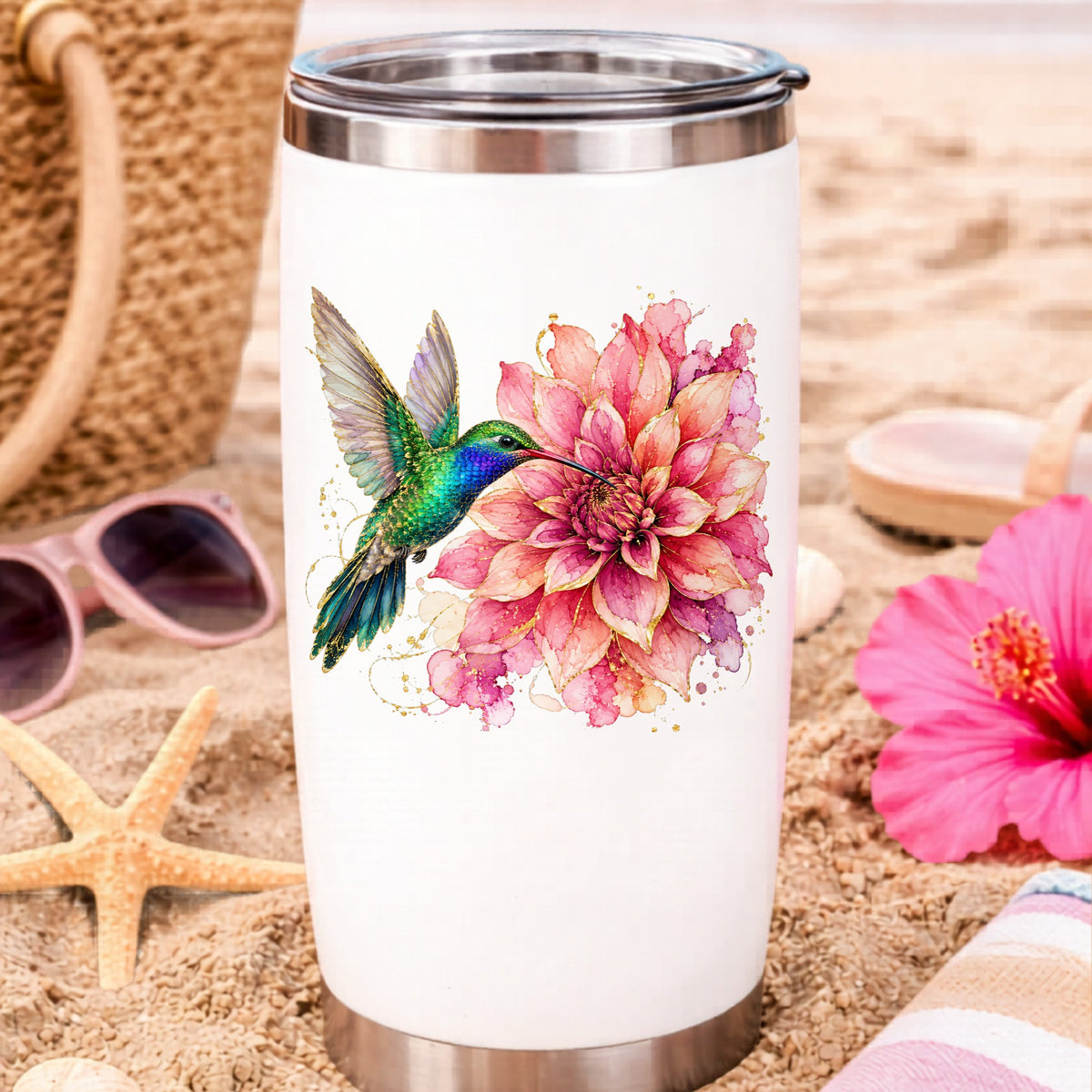 Hummingbird Pink Dahlia UV DTF sticker applied to a white travel tumbler on beach sand