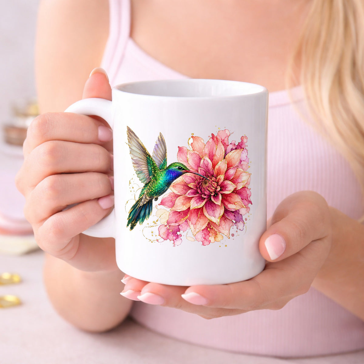 Hummingbird Pink Dahlia UV DTF sticker applied to a white coffee mug held in both hands