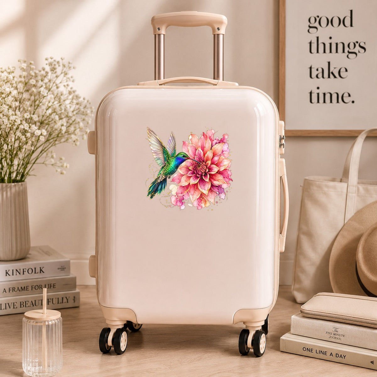 Hummingbird Pink Dahlia UV DTF sticker applied to a cream carry-on suitcase
