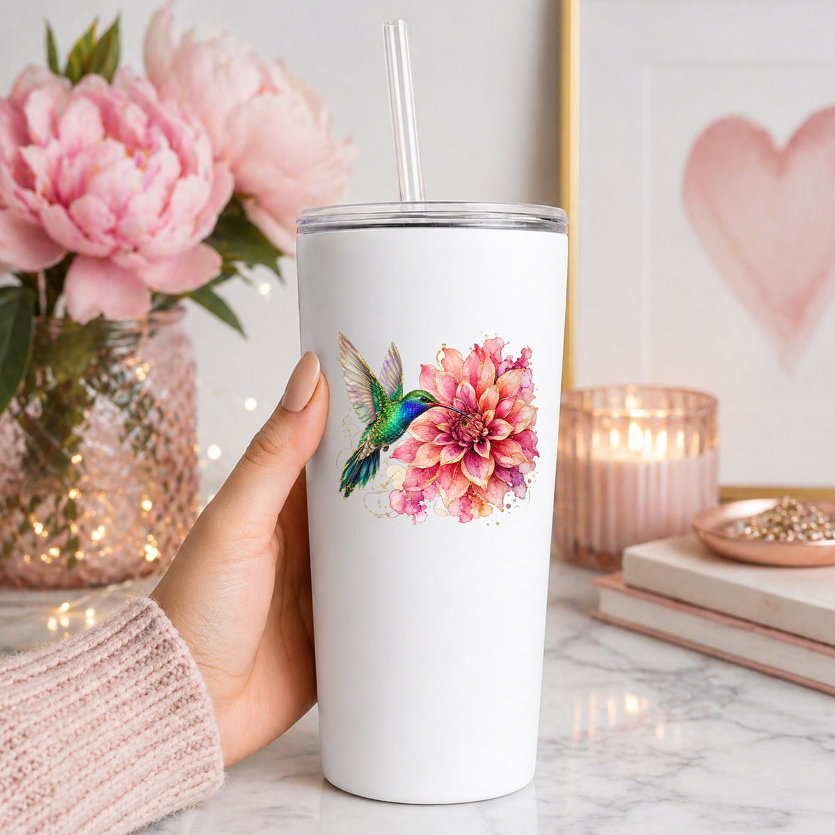 Hummingbird Pink Dahlia UV DTF sticker applied to a white straw tumbler beside pink peonies