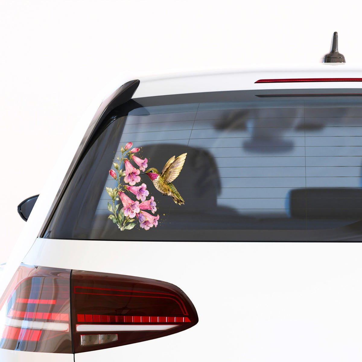 Ruby Throated Hummingbird Pink Bells UV DTF sticker applied to the rear window of a white car