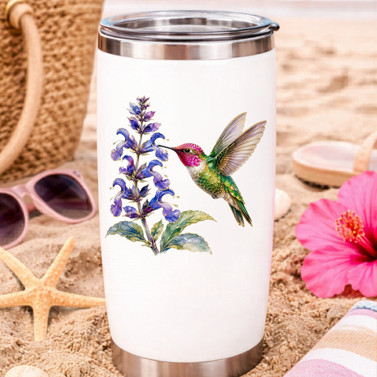 Hummingbird Purple Salvia UV DTF sticker applied to a white travel tumbler on beach sand