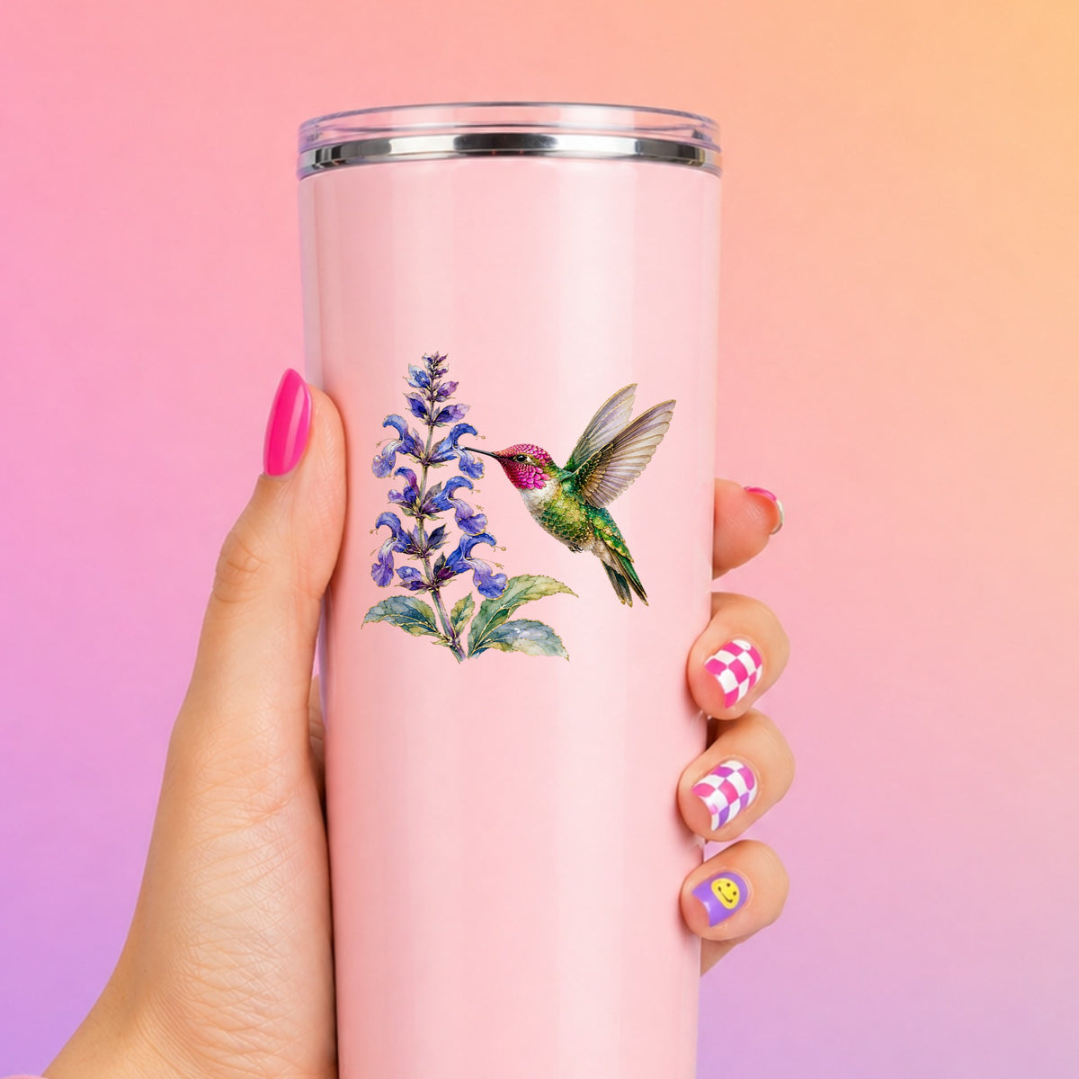 Hummingbird Purple Salvia UV DTF sticker applied to a tall pink tumbler on a pink and orange background