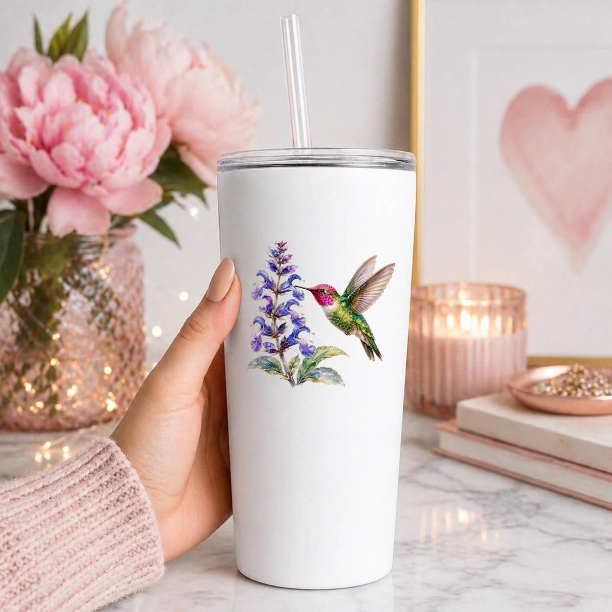 Hummingbird Purple Salvia UV DTF sticker applied to a white straw tumbler beside pink peonies