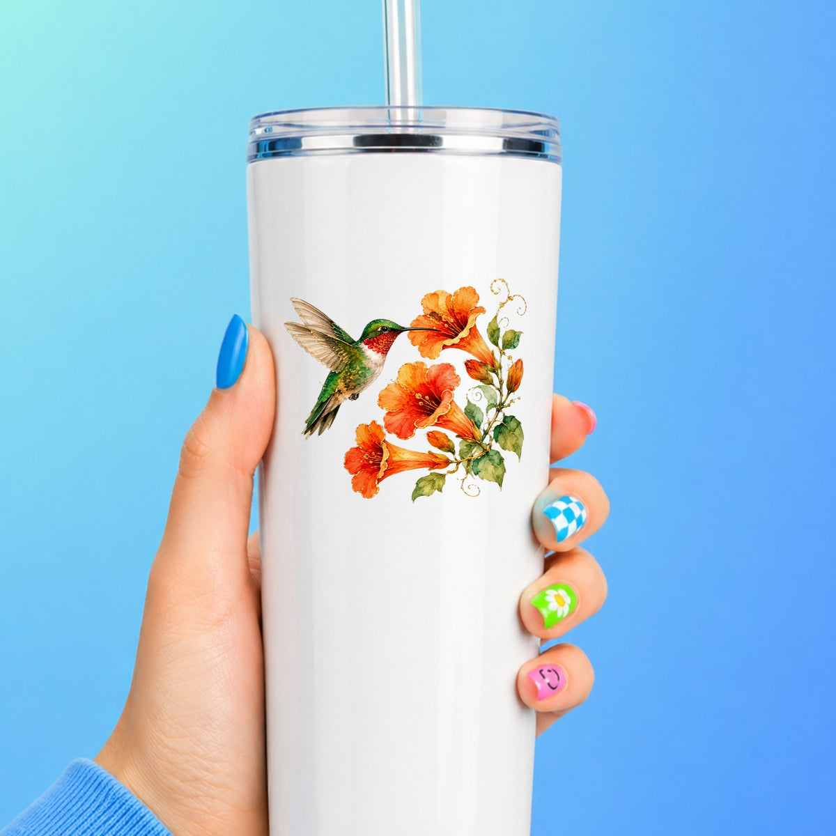 Red Throat Hummingbird Trumpet Flowers UV DTF sticker applied to a white straw tumbler on a blue background