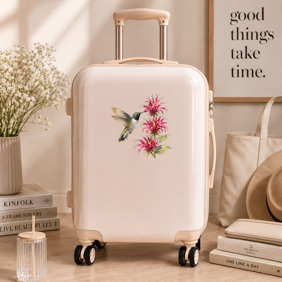 Hummingbird Pink Bee Balm UV DTF sticker applied to a cream carry-on suitcase
