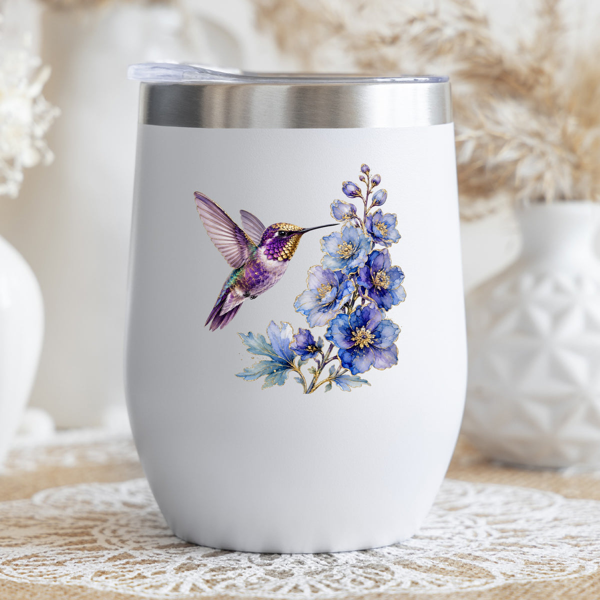 Purple Hummingbird Blue Delphinium UV DTF sticker applied to a white stemless tumbler with a lid