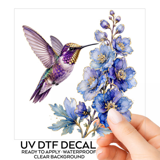 Purple Hummingbird Blue Delphinium UV DTF sticker on its backing card, held in hand