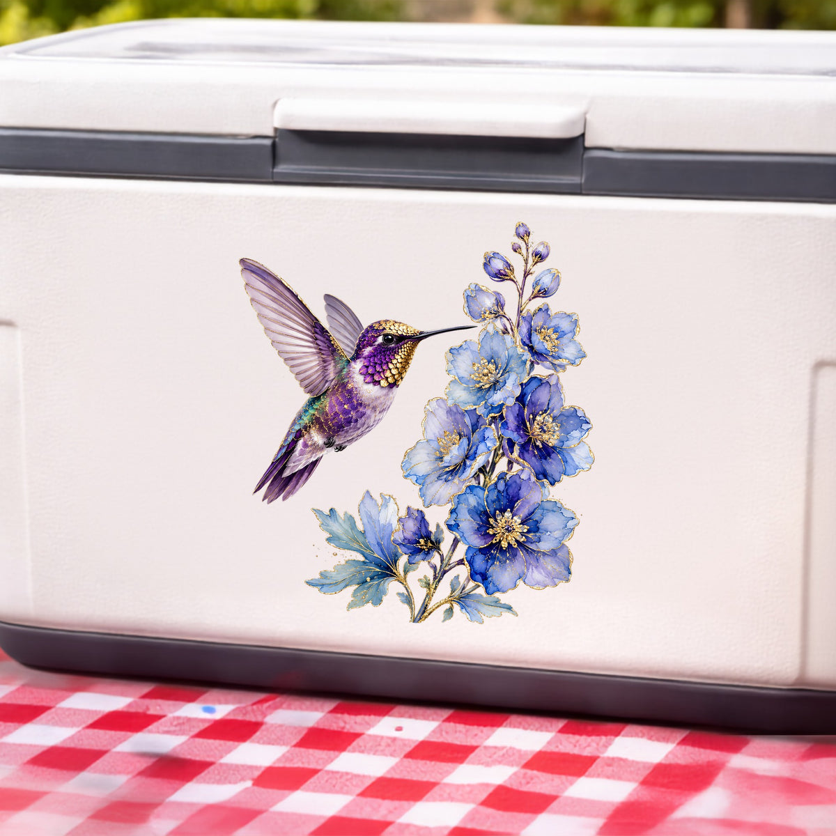 Purple Hummingbird Blue Delphinium UV DTF sticker applied to a white cooler on a red gingham cloth