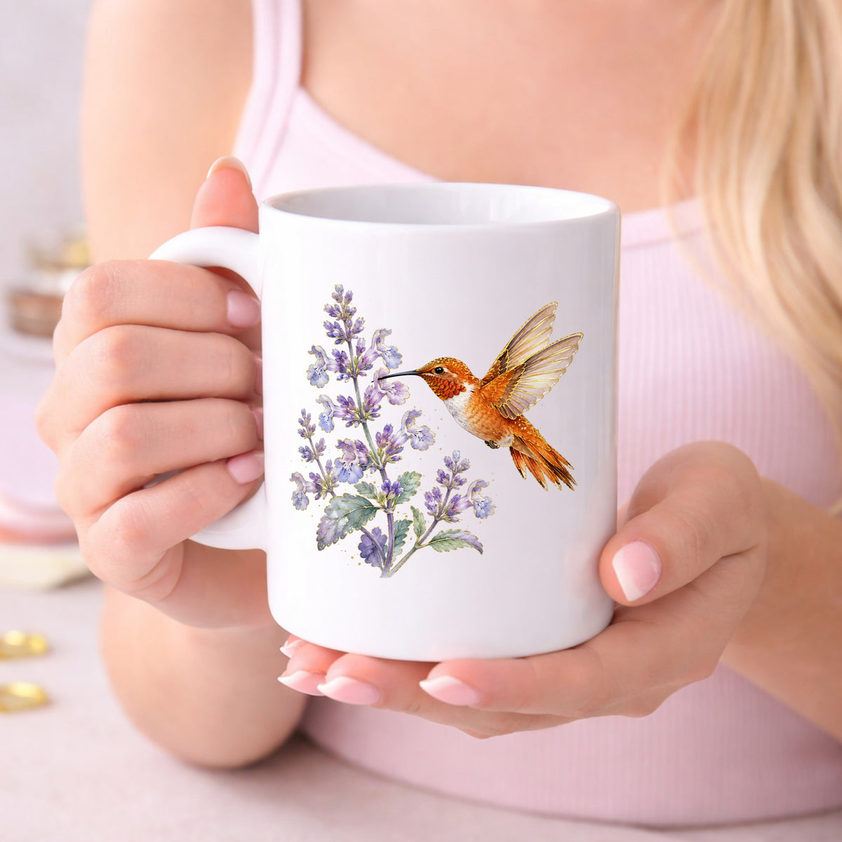 Rufous Hummingbird Lavender UV DTF sticker applied to a white coffee mug held in both hands