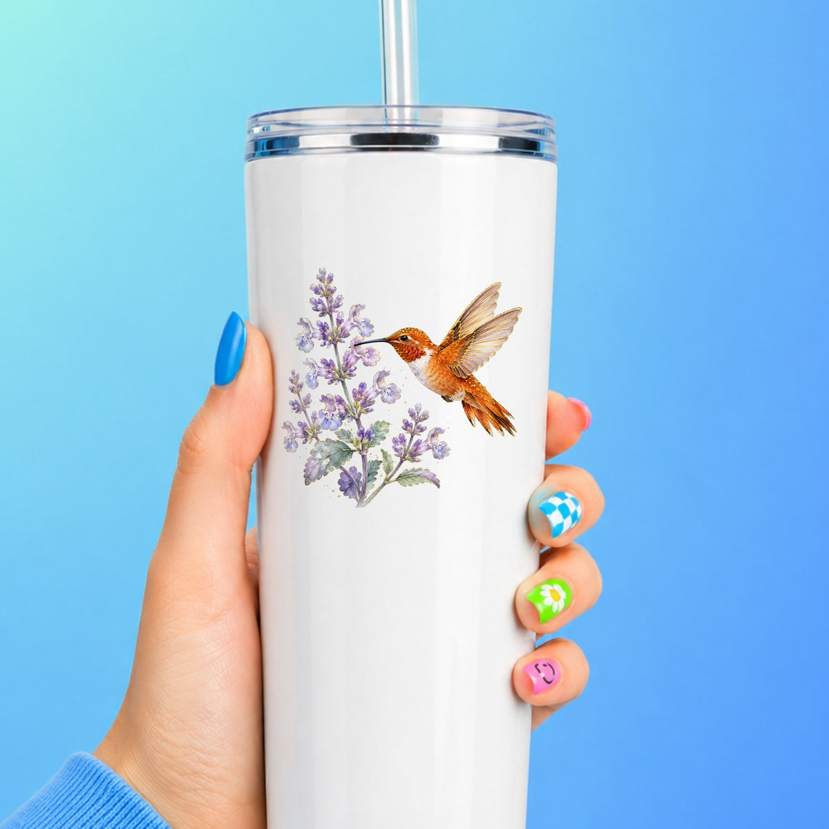 Rufous Hummingbird Lavender UV DTF sticker applied to a white straw tumbler on a blue background