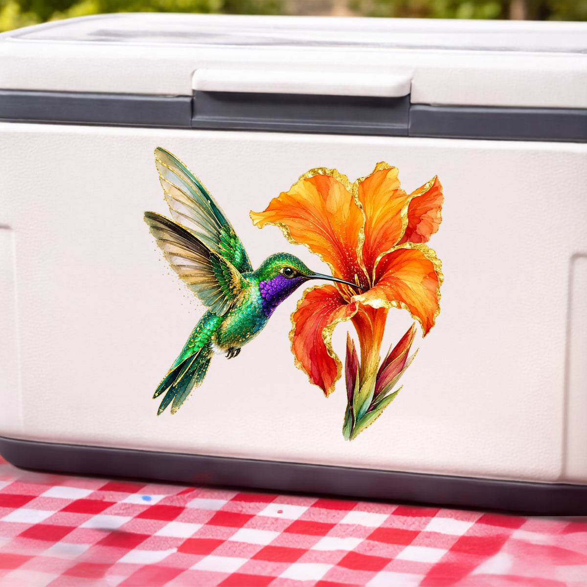 Hummingbird Orange Canna Lily UV DTF sticker applied to a white cooler on a red gingham cloth
