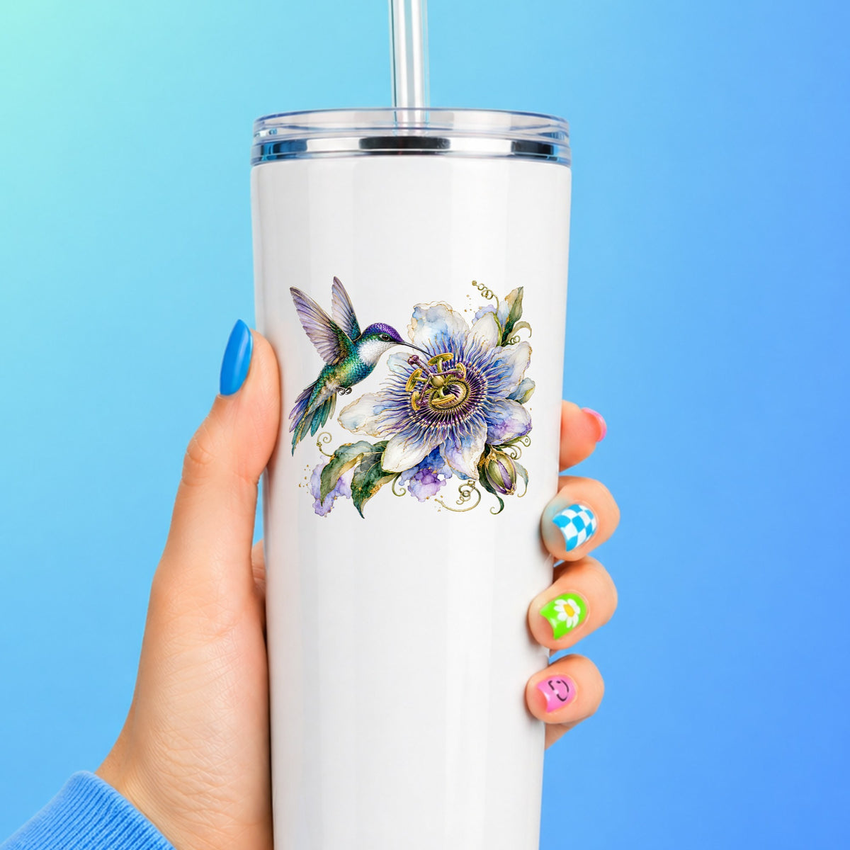 Hummingbird Passion Flower UV DTF sticker applied to a white straw tumbler on a blue background