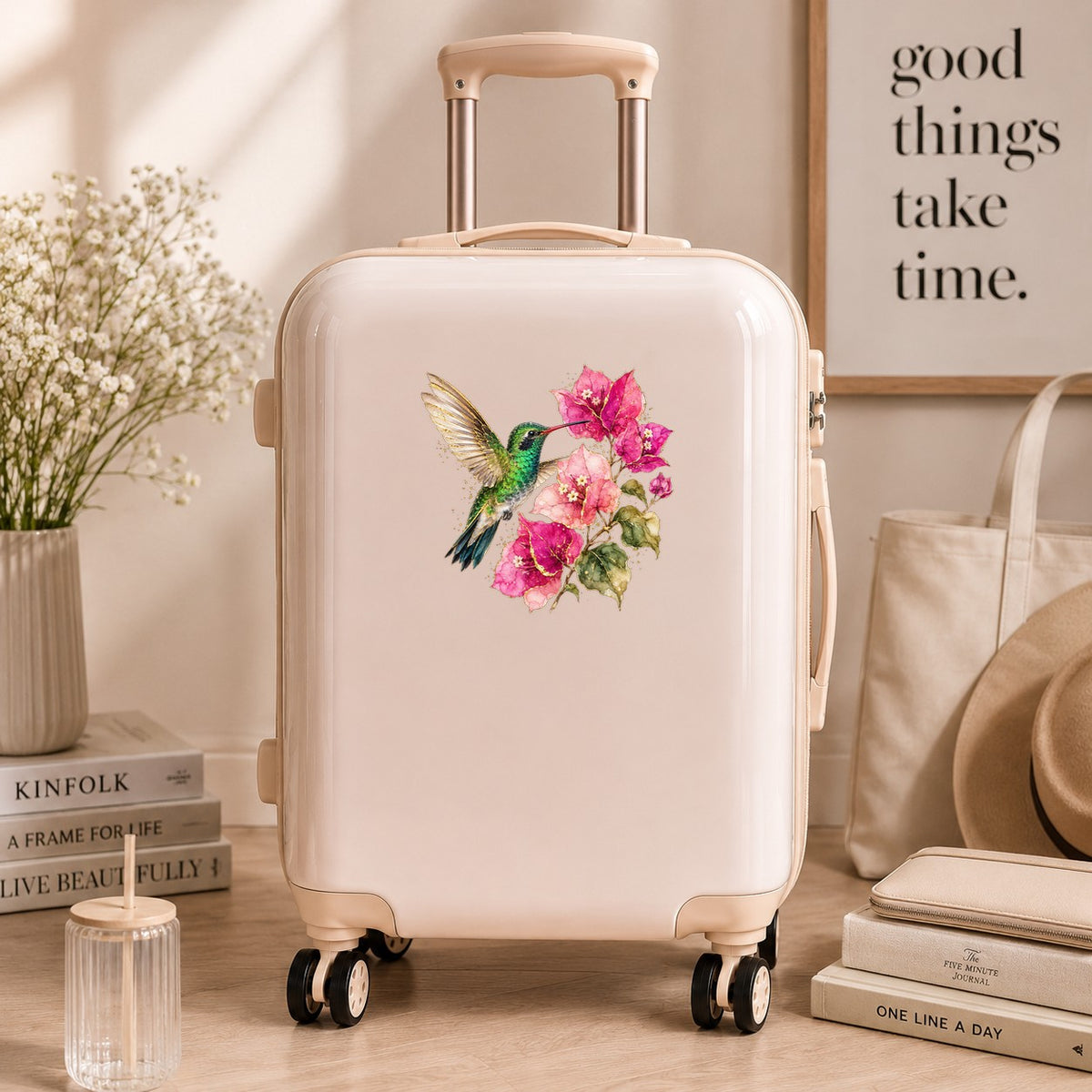 Hummingbird Pink Bougainvillea UV DTF sticker applied to a cream carry-on suitcase