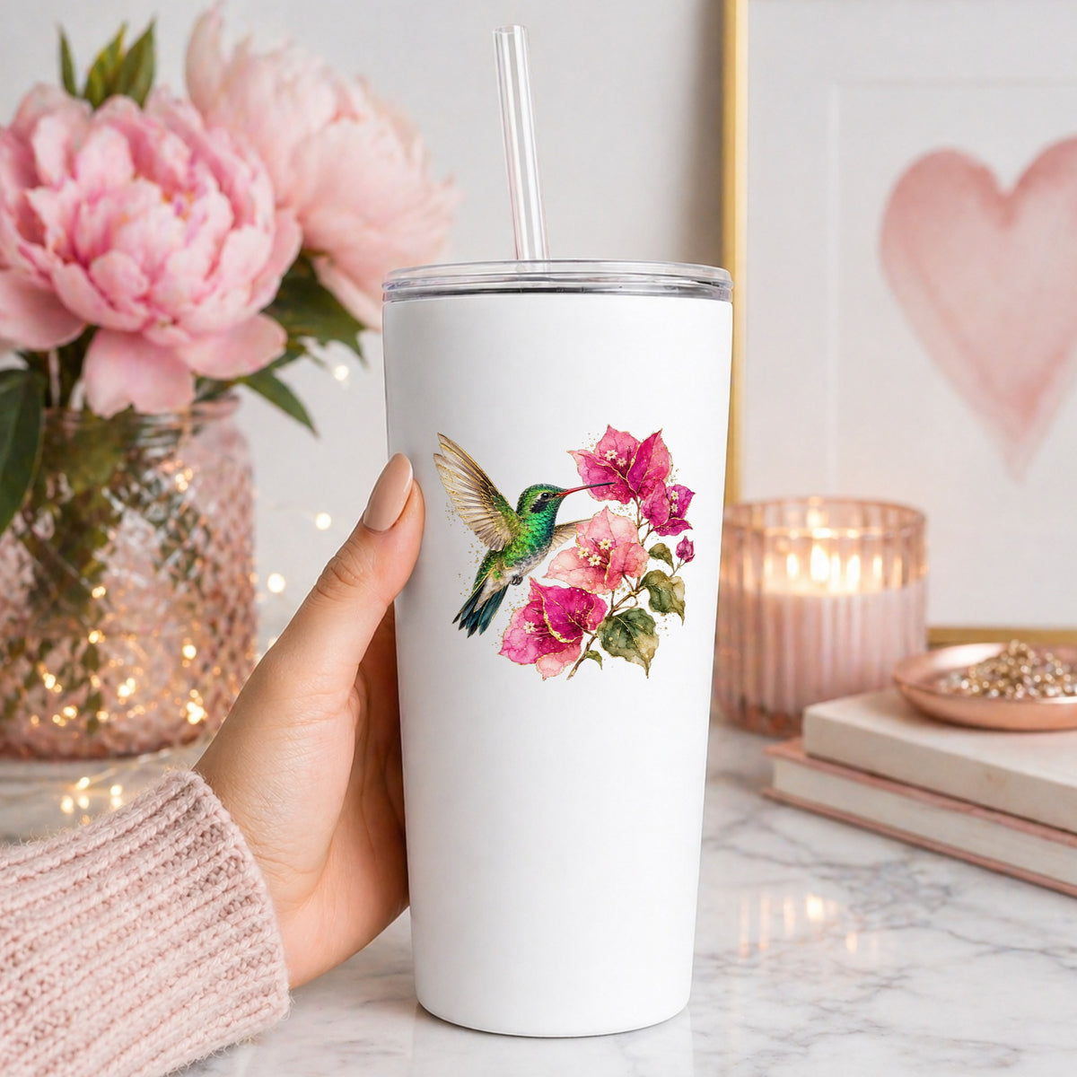 Hummingbird Pink Bougainvillea UV DTF sticker applied to a white straw tumbler beside pink peonies