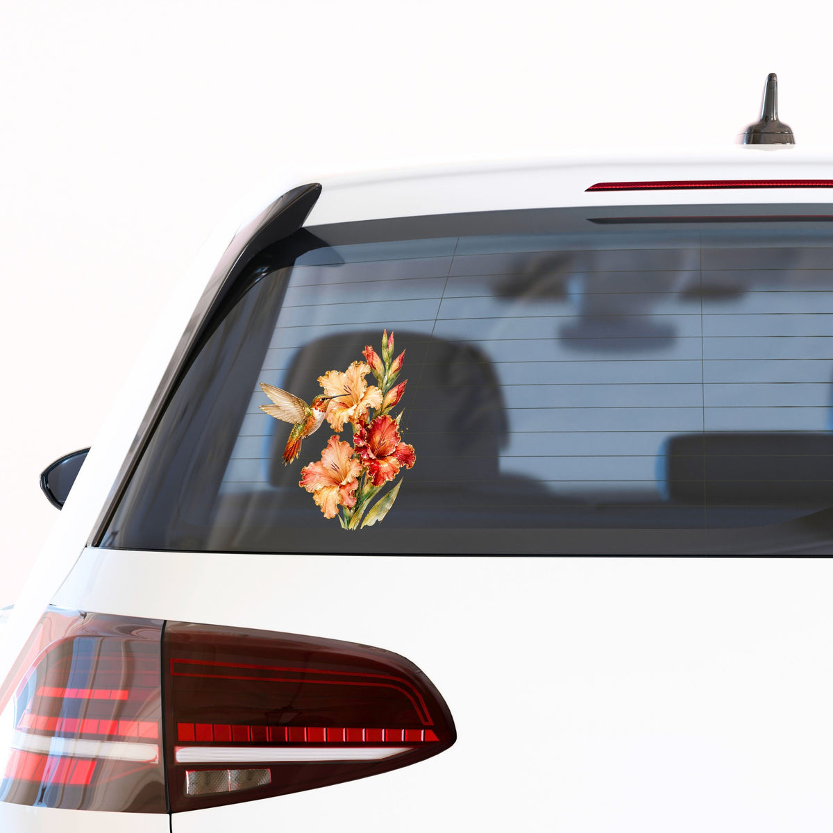 Hummingbird Peach Gladiolus UV DTF sticker applied to the rear window of a white car