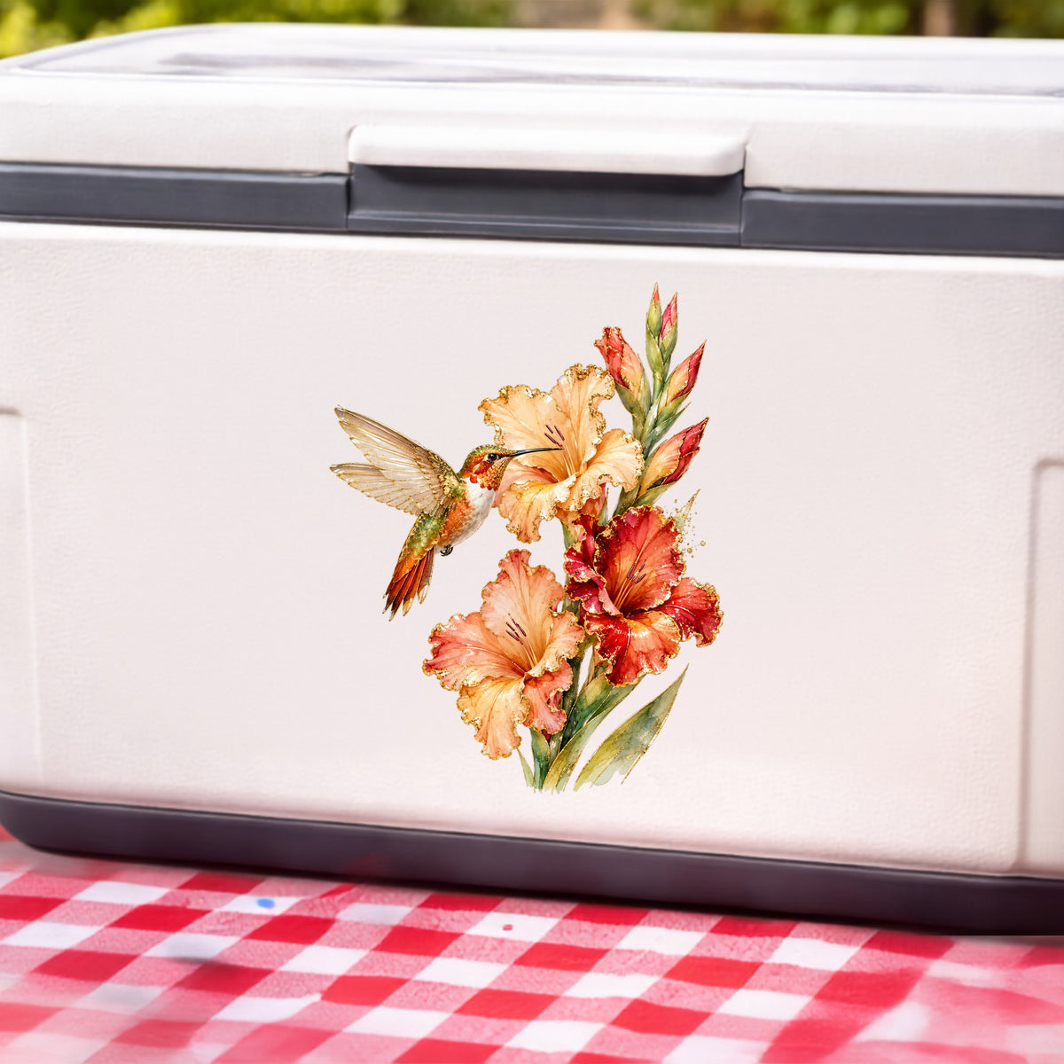 Hummingbird Peach Gladiolus UV DTF sticker applied to a white cooler on a red gingham cloth