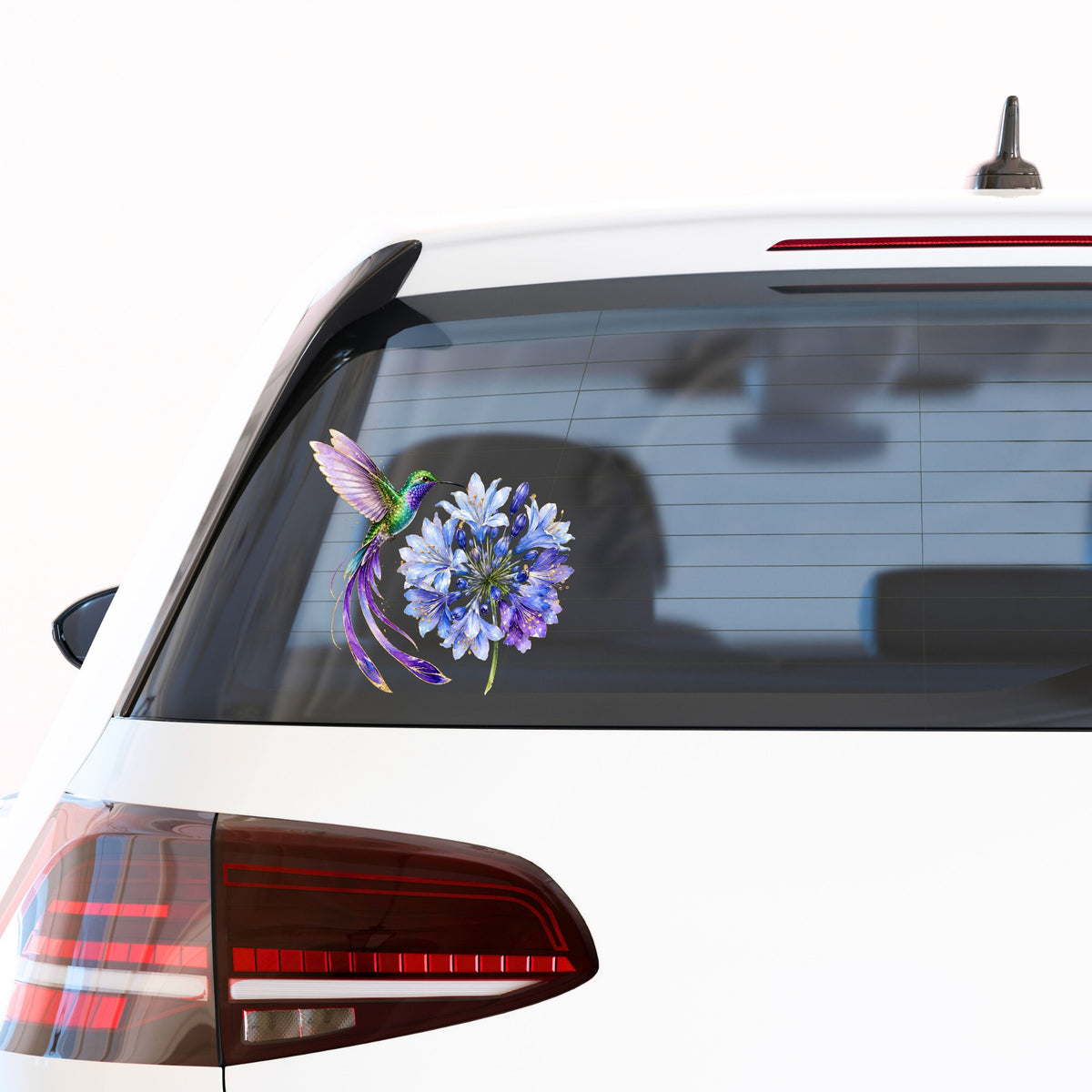 Hummingbird Blue Agapanthus UV DTF sticker applied to the rear window of a white car