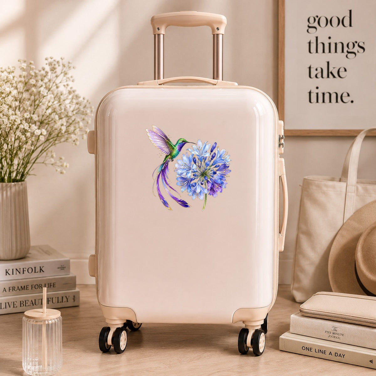 Hummingbird Blue Agapanthus UV DTF sticker applied to a cream carry-on suitcase