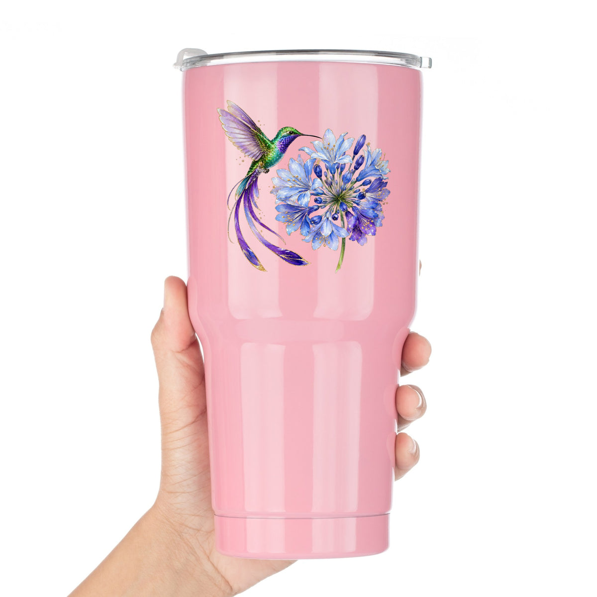Hummingbird Blue Agapanthus UV DTF sticker applied to a pink tumbler held against a white background