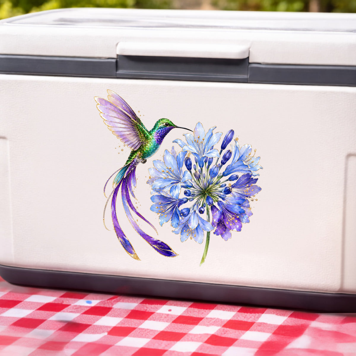 Hummingbird Blue Agapanthus UV DTF sticker applied to a white cooler on a red gingham cloth