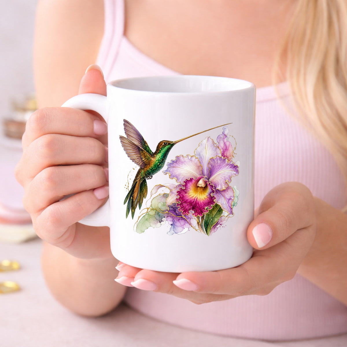 Hummingbird Purple Orchid UV DTF sticker applied to a white coffee mug held in both hands