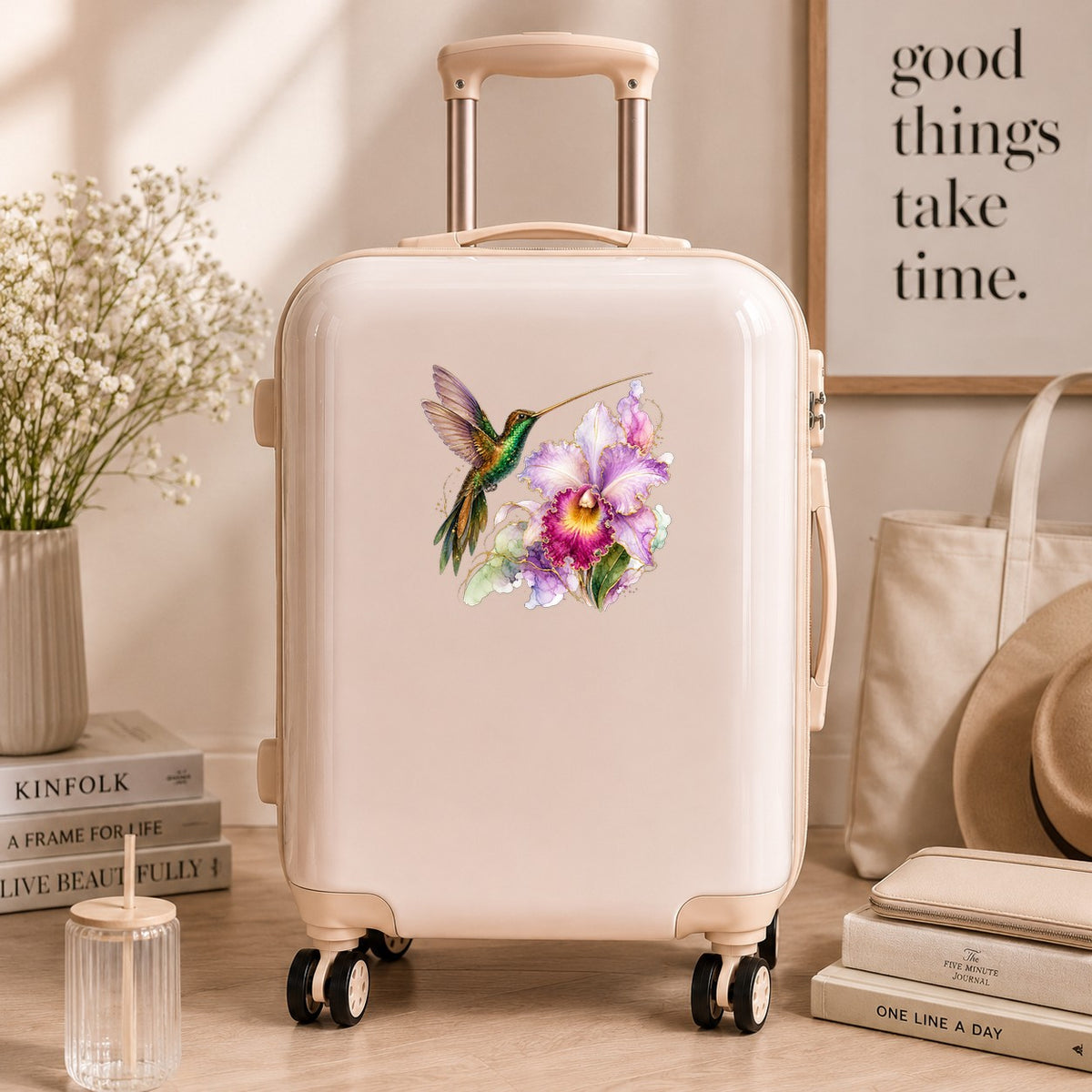 Hummingbird Purple Orchid UV DTF sticker applied to a cream carry-on suitcase