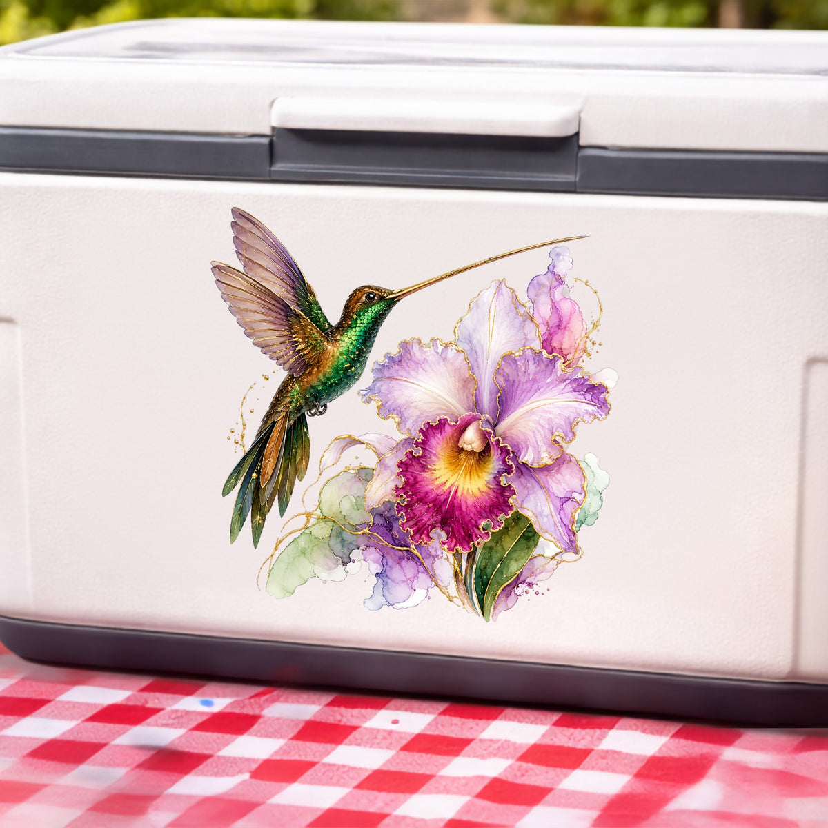 Hummingbird Purple Orchid UV DTF sticker applied to a white cooler on a red gingham cloth