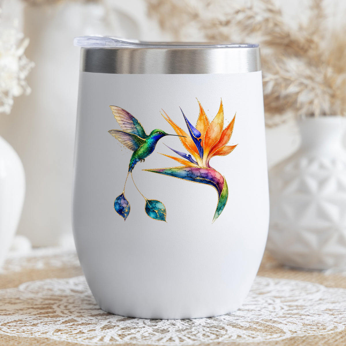 Hummingbird Bird Of Paradise Flower UV DTF sticker applied to a white stemless tumbler with a lid