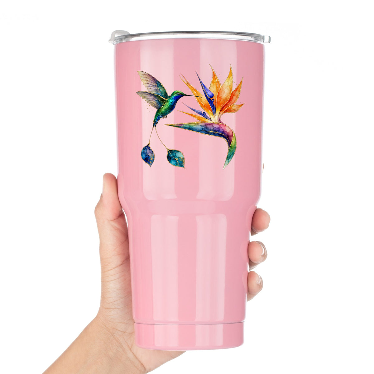 Hummingbird Bird Of Paradise Flower UV DTF sticker applied to a pink tumbler held against a white background